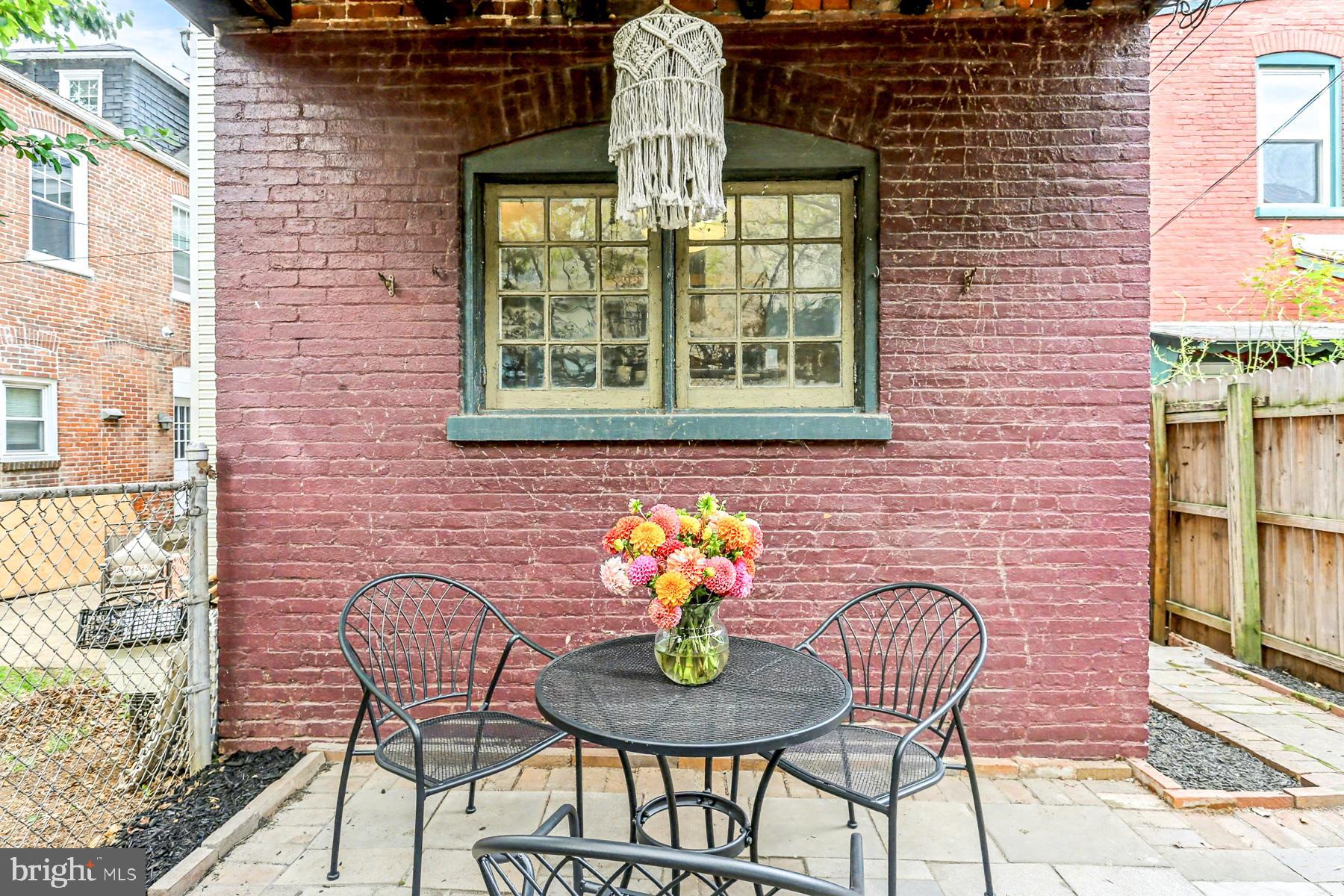 16 West Liberty Street Lancaster, PA 17603 - Photo 23 of 55 a view of a brick house with table and chairs