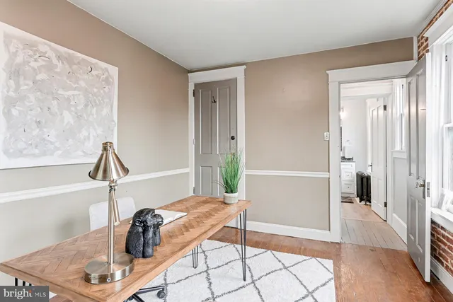 a wooden fence with trees in the background