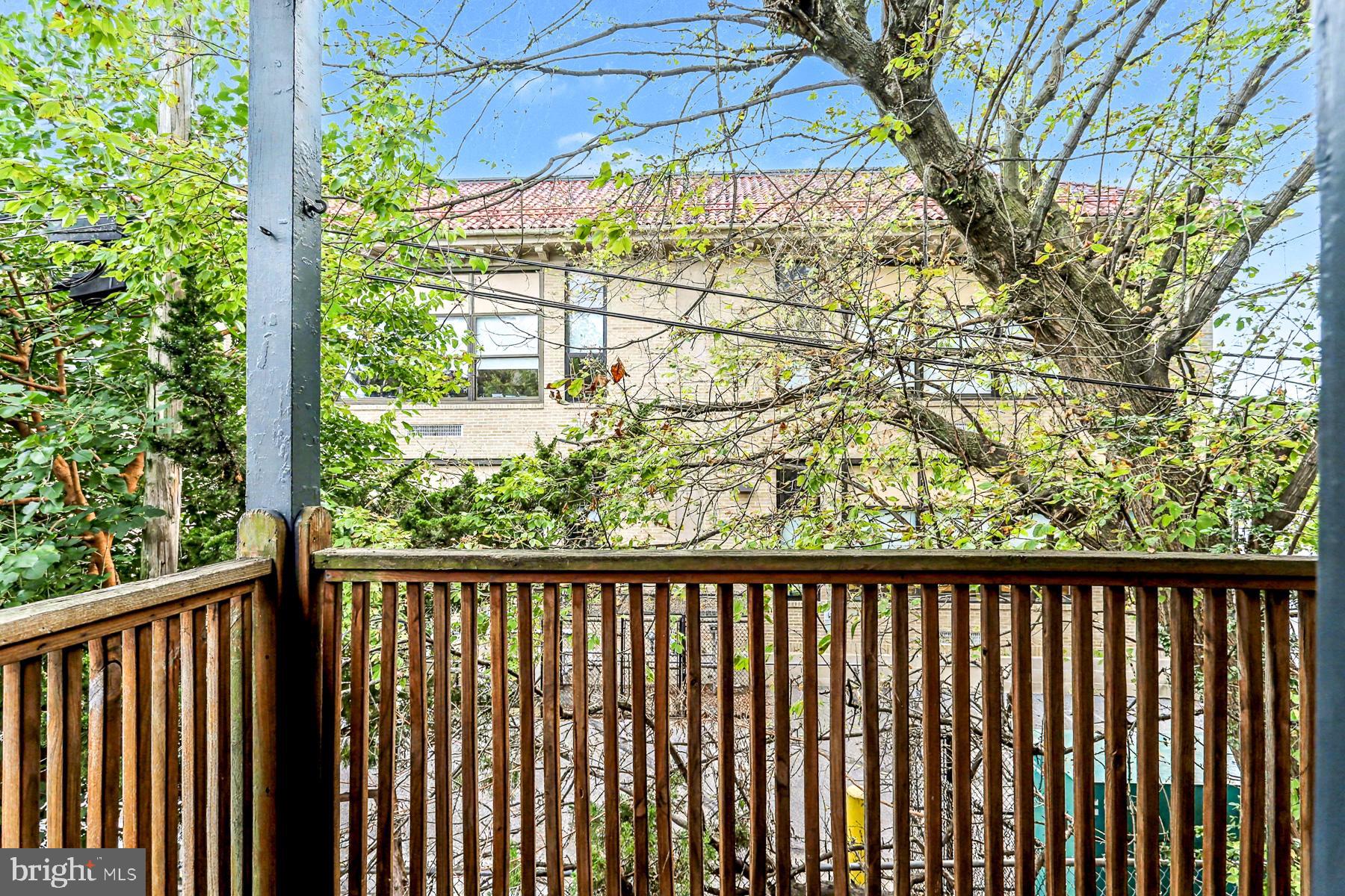 16 West Liberty Street Lancaster, PA 17603 - Photo 28 of 55 a wooden deck with trees in the back
