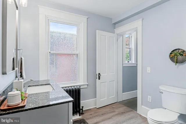 a bathroom with a sink a mirror and a bathtub