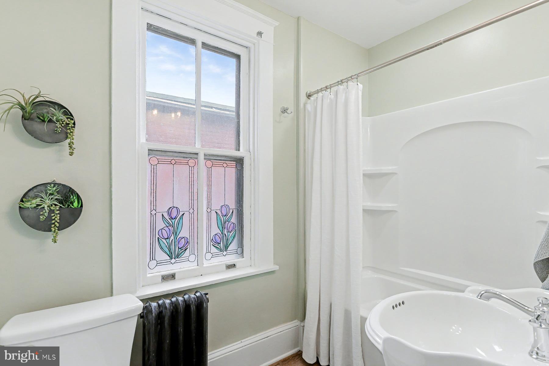 16 West Liberty Street Lancaster, PA 17603 - Photo 32 of 55 a bathroom with a bathtub and a shower