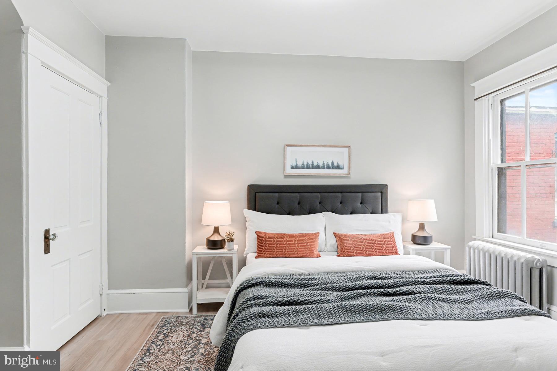 16 West Liberty Street Lancaster, PA 17603 - Photo 34 of 55 a bedroom with a bed and wooden floor