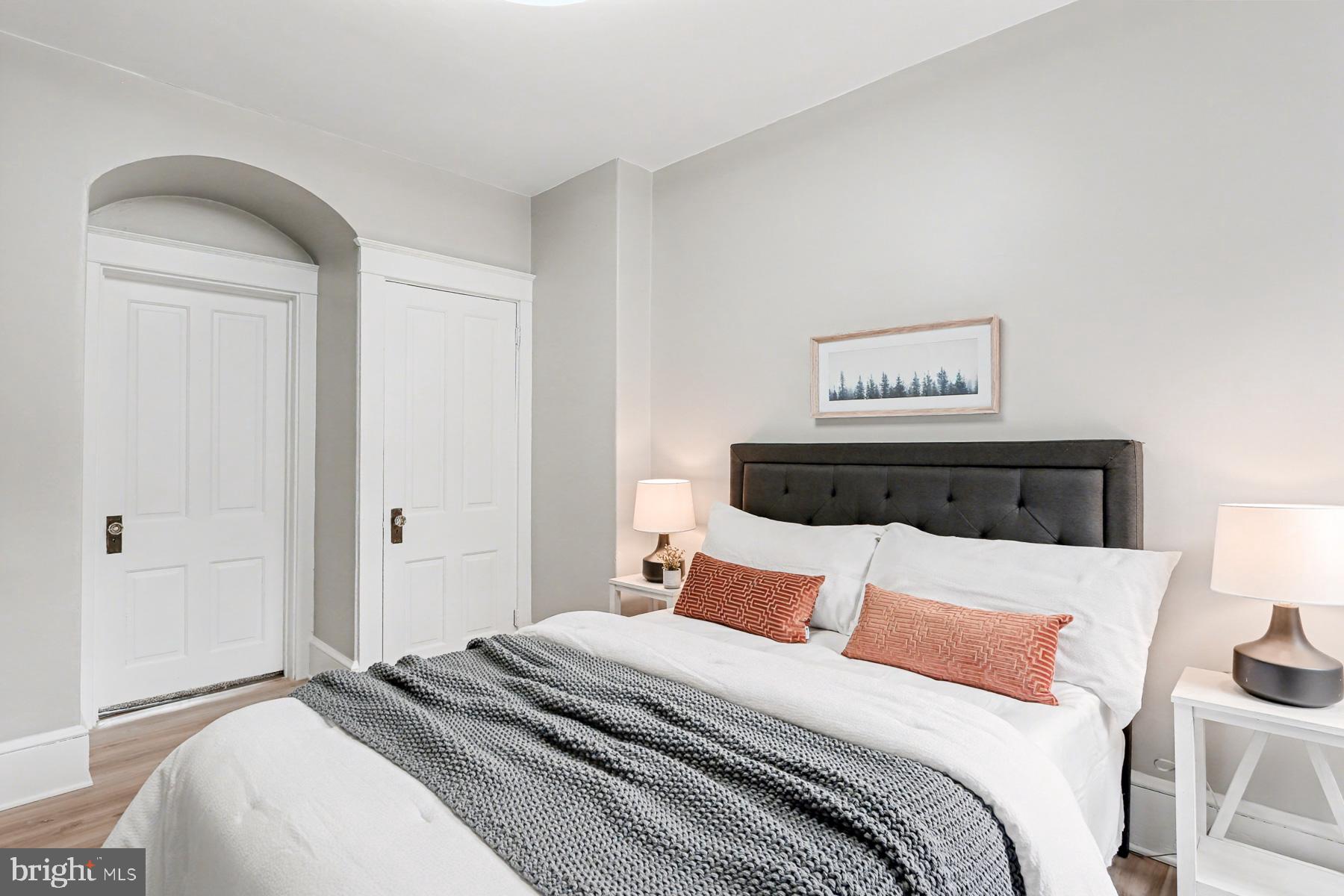 16 West Liberty Street Lancaster, PA 17603 - Photo 36 of 55 a bedroom with a bed and a painting on the wall