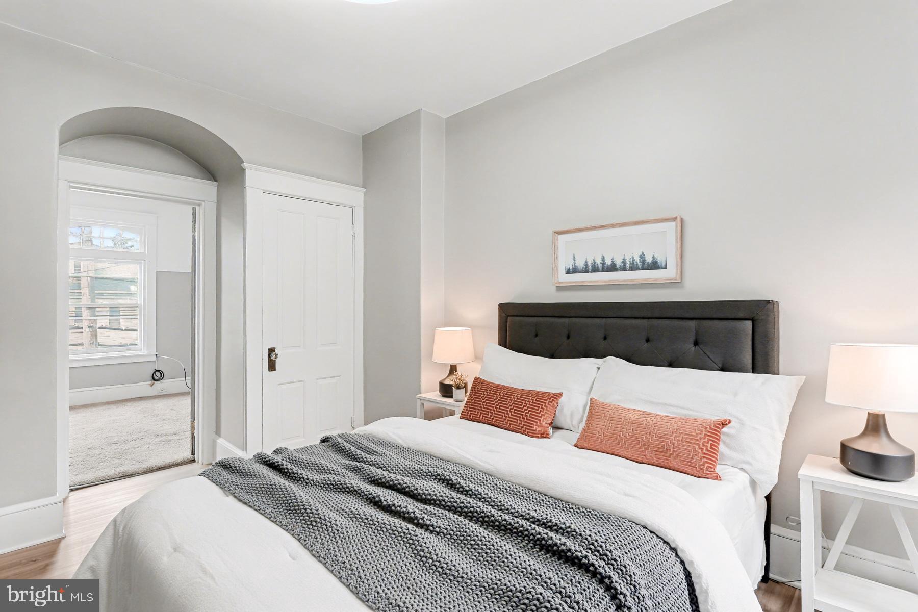 16 West Liberty Street Lancaster, PA 17603 - Photo 37 of 55 a bedroom with a bed and a lamp