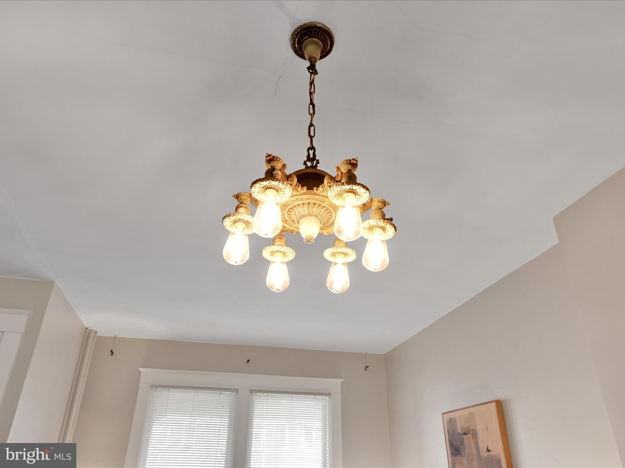 16 West Liberty Street Lancaster, PA 17603 - Photo 47 of 55 a room with a chandelier fan and a stove