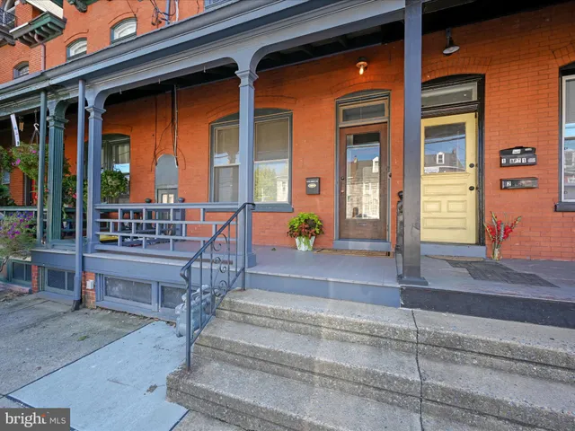 a view of a balcony with potted plants