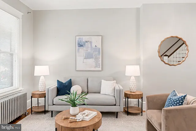 a living room with furniture and a window