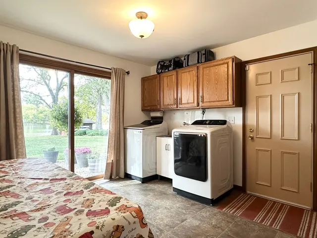 a room with a table chairs and entryway