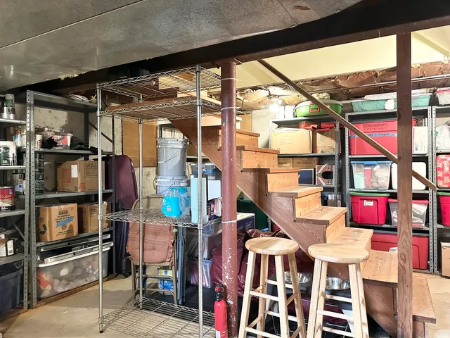 a view of backyard with outdoor seating and trees