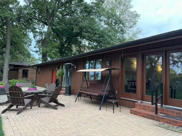 a front view of a house with a yard and balcony
