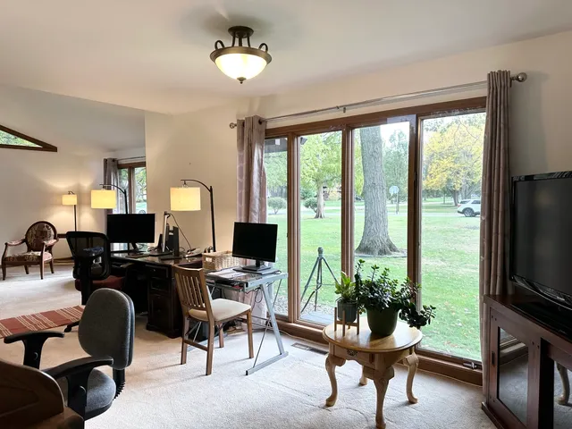 a kitchen with stainless steel appliances granite countertop a refrigerator sink and stove