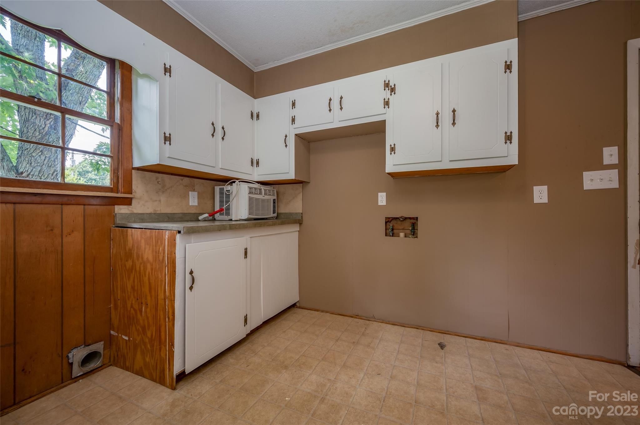 1034 Old Stonecutter Road Rutherfordton, NC 28139 - Photo 14 of 27 a kitchen with cabinets and window