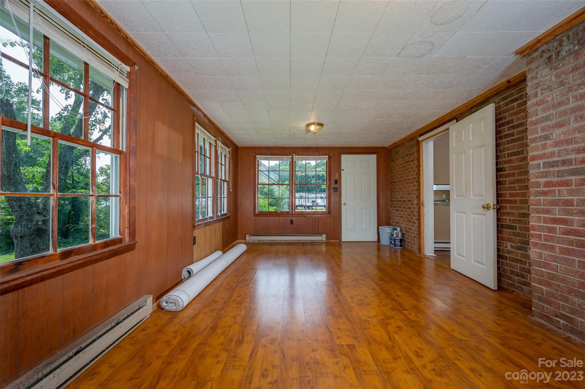 1034 Old Stonecutter Road Rutherfordton, NC 28139 - Photo 18 of 27 a view of an empty room with wooden floor and a window