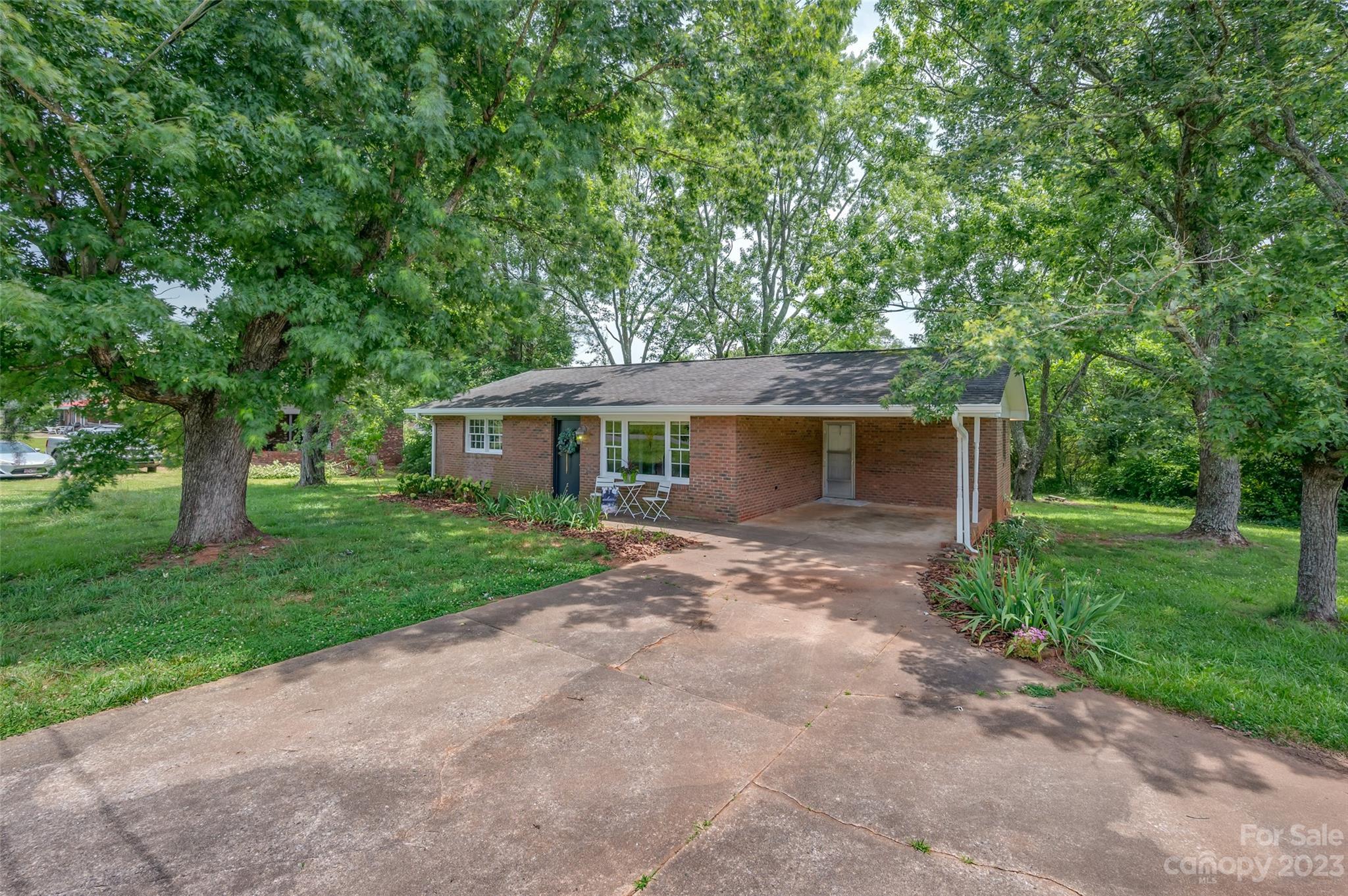 1034 Old Stonecutter Road Rutherfordton, NC 28139 - Photo 2 of 27 a front view of a house with garden