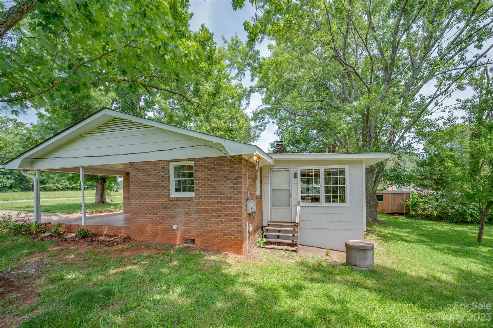 1034 Old Stonecutter Road Rutherfordton, NC 28139 - Photo 22 of 27 a backyard of a house with table and chairs
