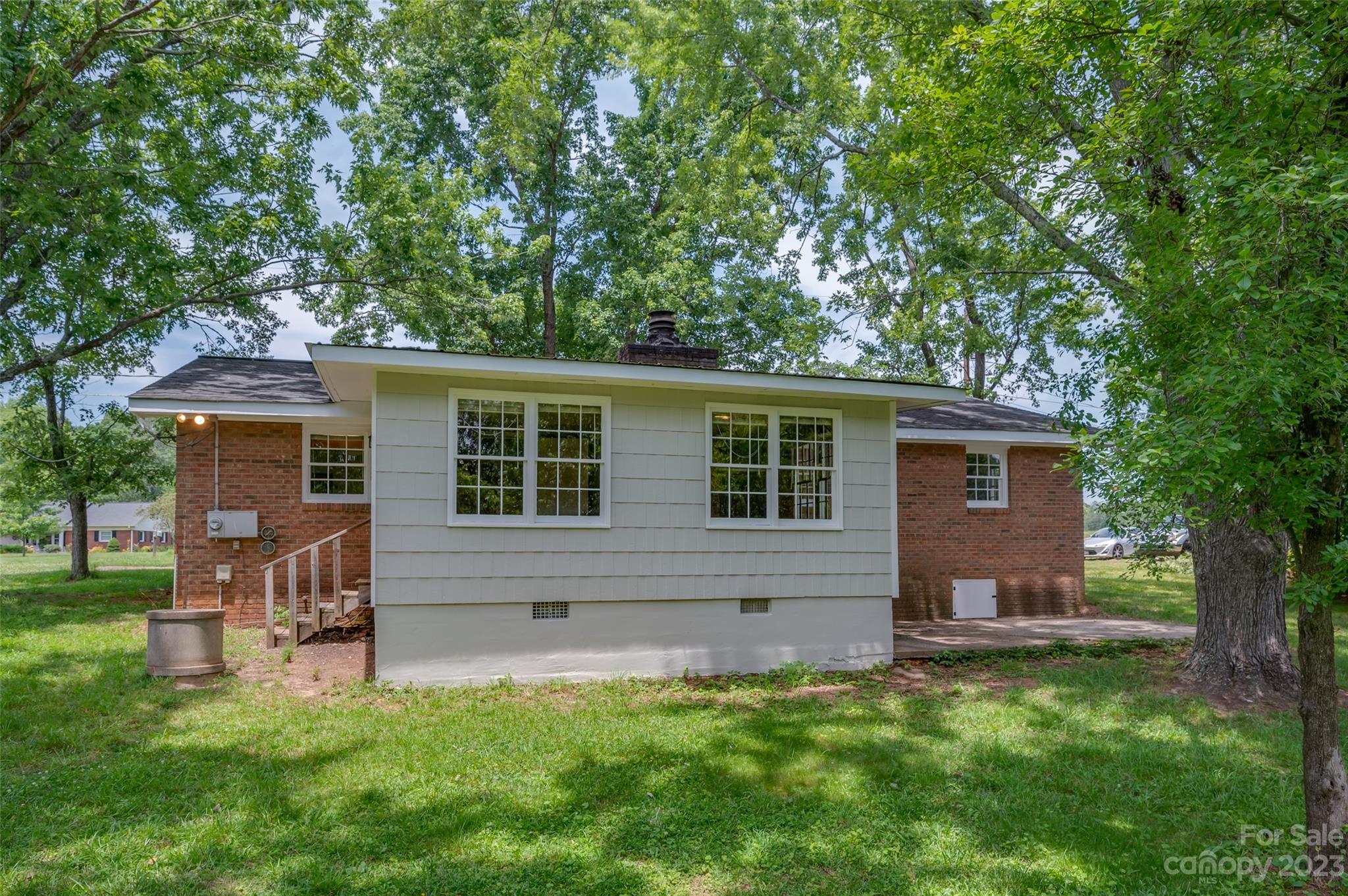1034 Old Stonecutter Road Rutherfordton, NC 28139 - Photo 3 of 27 a backyard of a house with table and chairs