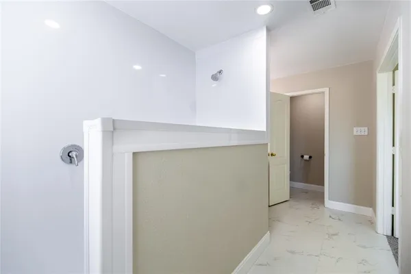 a view of a room with a hallway