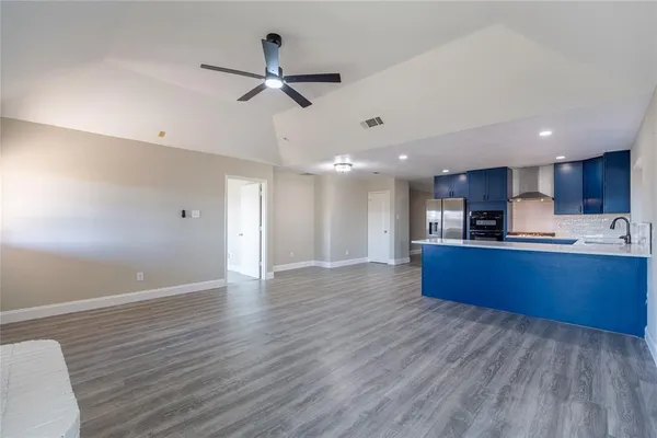 a view of kitchen with wooden floor and window