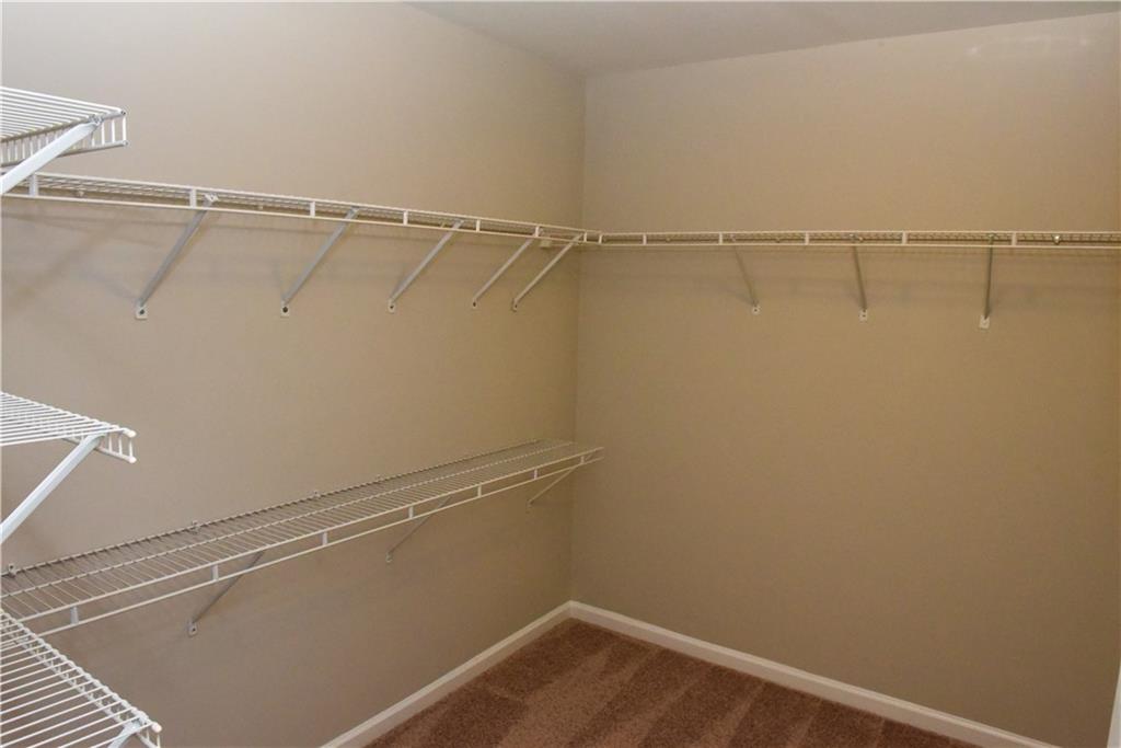 12720 Morningpark Circle Alpharetta, GA 30004 - Photo 14 of 31 a view of a room with racks on the wall