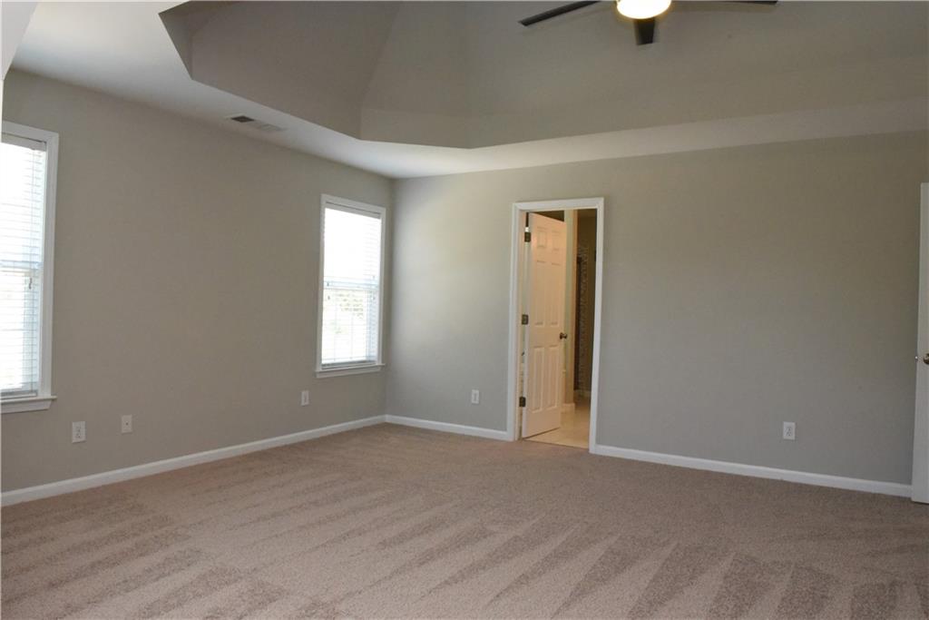 12720 Morningpark Circle Alpharetta, GA 30004 - Photo 15 of 31 an empty room with wooden floor and windows