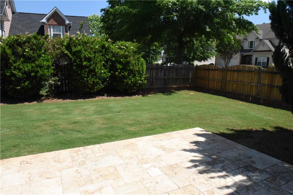 12720 Morningpark Circle Alpharetta, GA 30004 - Photo 17 of 31 a view of a backyard with potted plants and large trees