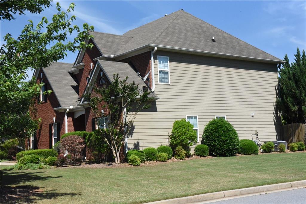 12720 Morningpark Circle Alpharetta, GA 30004 - Photo 22 of 31 a front view of a house with a yard