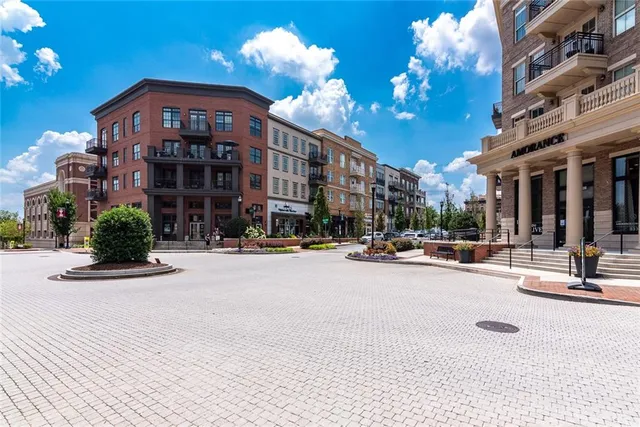 a view of a building with sitting area
