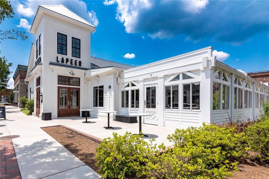 12720 Morningpark Circle Alpharetta, GA 30004 - Photo 26 of 31 a front view of a house with a porch