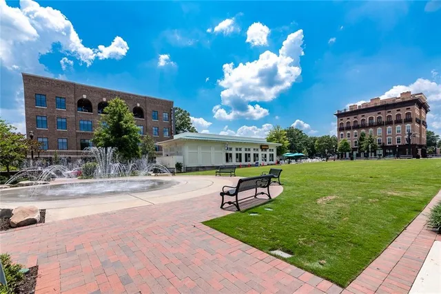 a view of a house with a backyard porch and sitting area