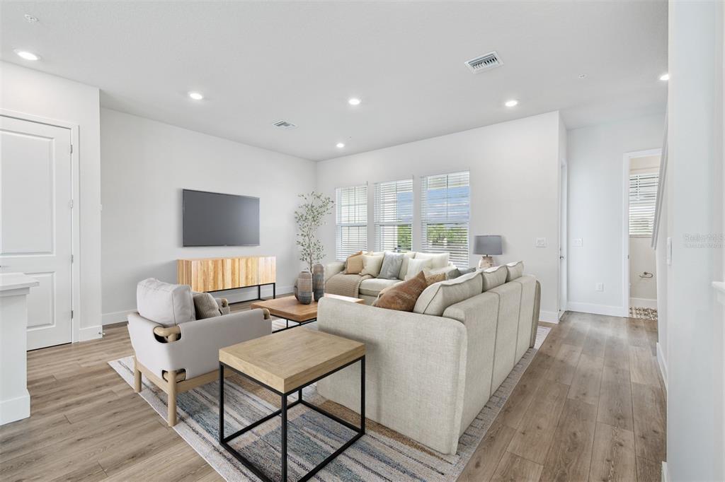 7204 Sutton Lane Sarasota, FL 34240 - Photo 18 of 47 a living room with furniture and a flat screen tv
