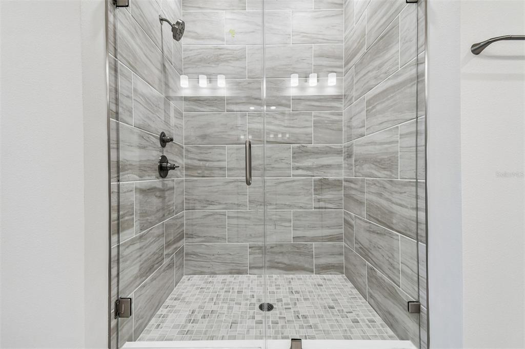 7204 Sutton Lane Sarasota, FL 34240 - Photo 26 of 47 a bathroom with a shower