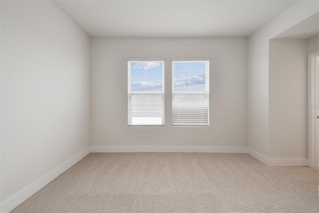 7204 Sutton Lane Sarasota, FL 34240 - Photo 32 of 47 an empty room with a window