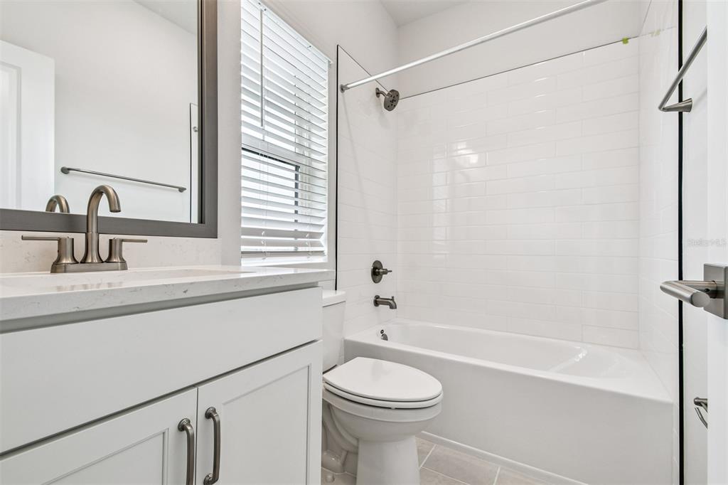 7204 Sutton Lane Sarasota, FL 34240 - Photo 34 of 47 a bathroom with a sink a toilet and a bathtub