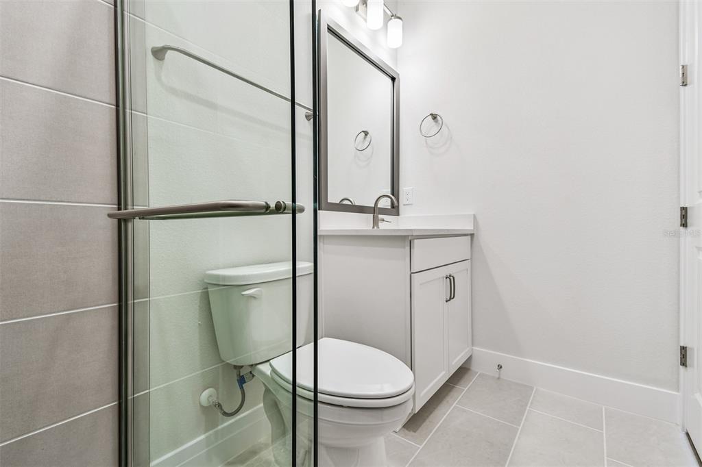 7204 Sutton Lane Sarasota, FL 34240 - Photo 37 of 47 a bathroom with a toilet a sink and a shower