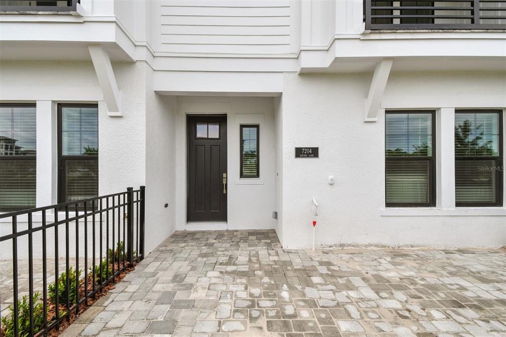 7204 Sutton Lane Sarasota, FL 34240 - Photo 6 of 47 a view of a house with a door and a window
