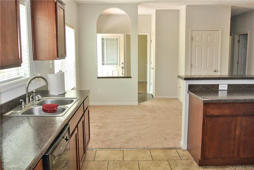 335 Upper Thomas Branch Road Marshall, NC 28753 - Photo 2 of 22 a kitchen with a sink stove and cabinets