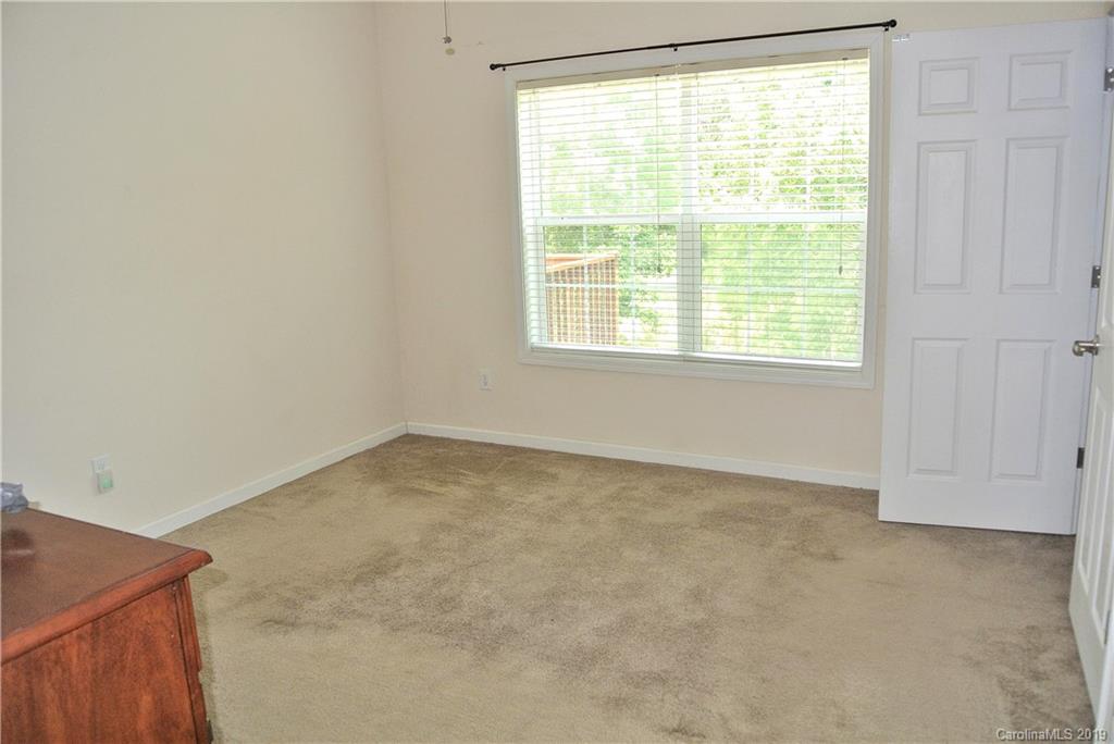 335 Upper Thomas Branch Road Marshall, NC 28753 - Photo 11 of 22 an empty room with a window