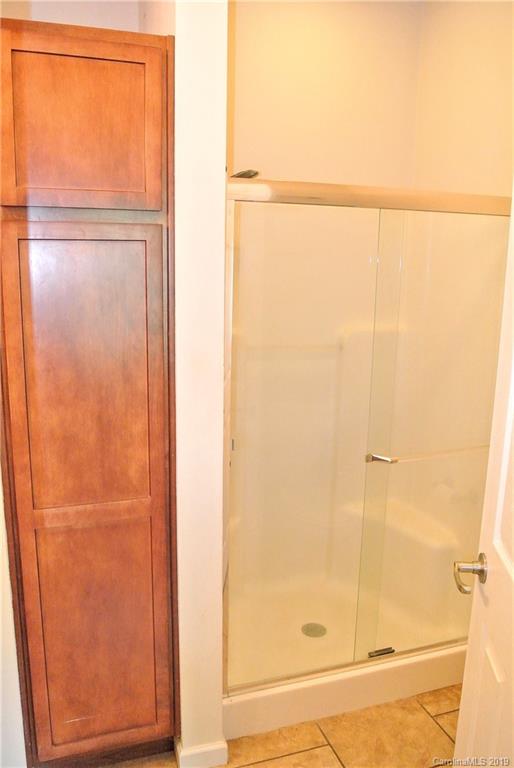 335 Upper Thomas Branch Road Marshall, NC 28753 - Photo 13 of 22 a bathroom with a glass shower door