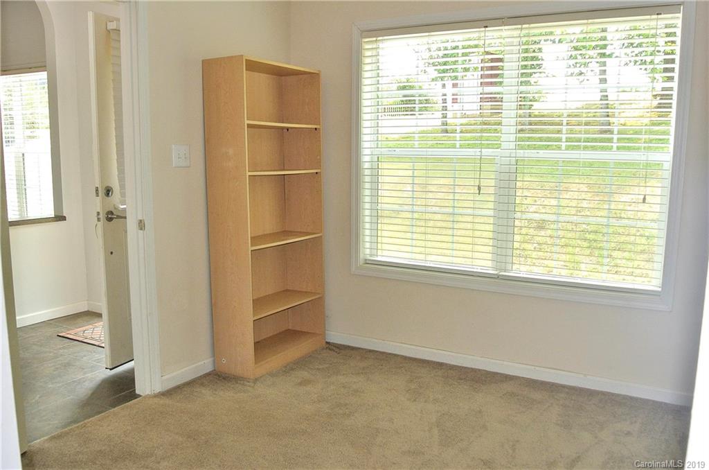 335 Upper Thomas Branch Road Marshall, NC 28753 - Photo 14 of 22 a view of an empty room with a window and closet area