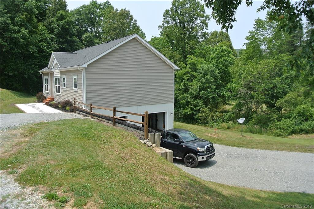 335 Upper Thomas Branch Road Marshall, NC 28753 - Photo 20 of 22 a view of backyard with a garden and entertaining space