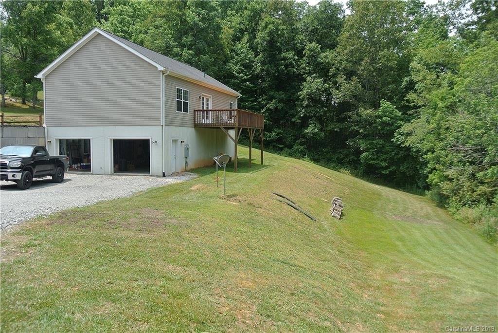 335 Upper Thomas Branch Road Marshall, NC 28753 - Photo 21 of 22 a view of a house with backyard and trees