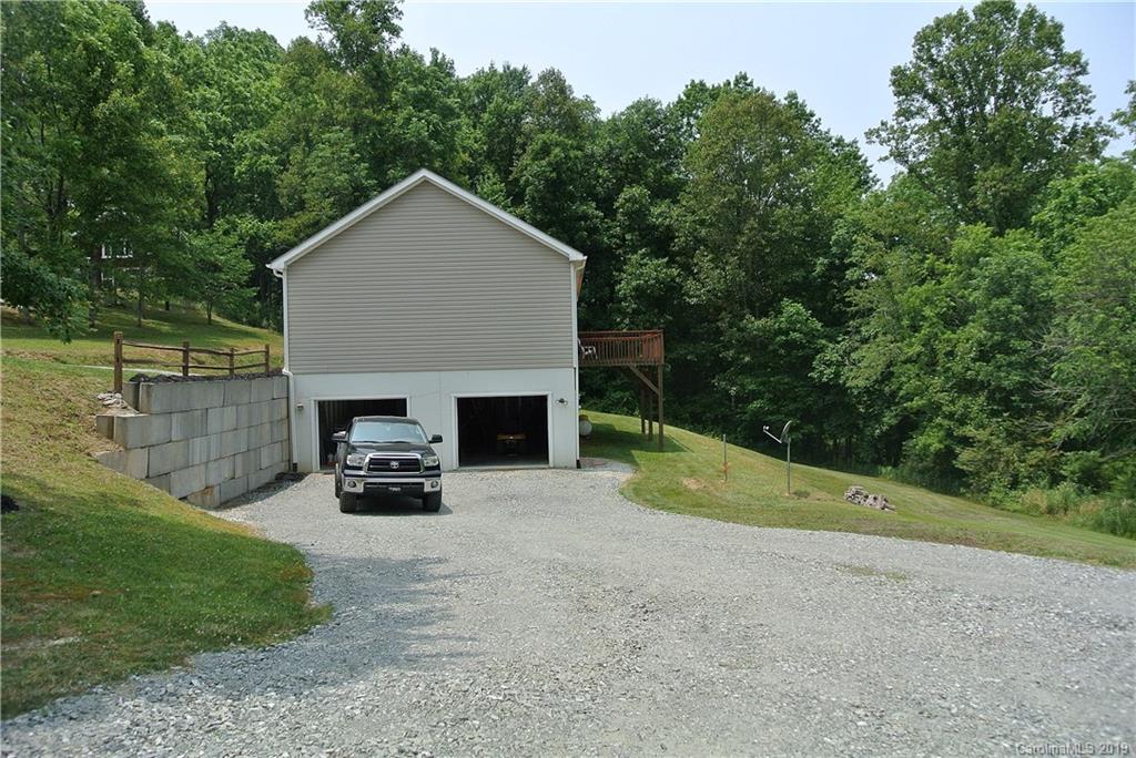 335 Upper Thomas Branch Road Marshall, NC 28753 - Photo 22 of 22 a view of a house with backyard and garden