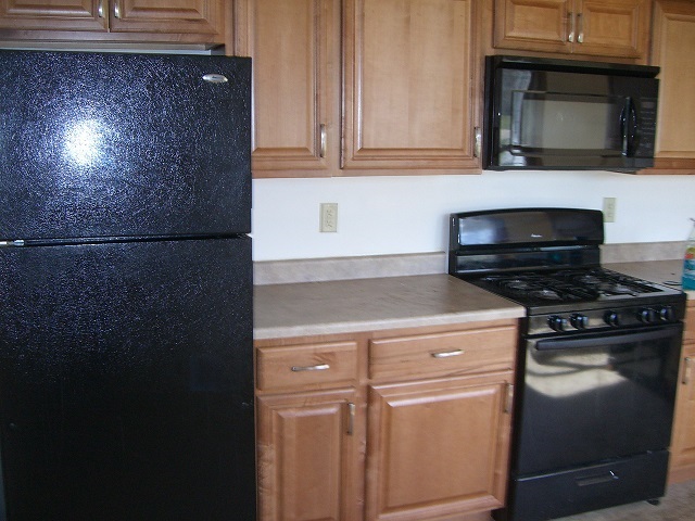 2114 Rivington Road Loves Park, IL 61111 - Photo 3 of 7 a kitchen with a stove and a microwave