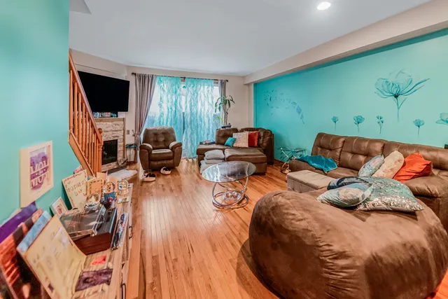 a bedroom with furniture and a flat screen tv