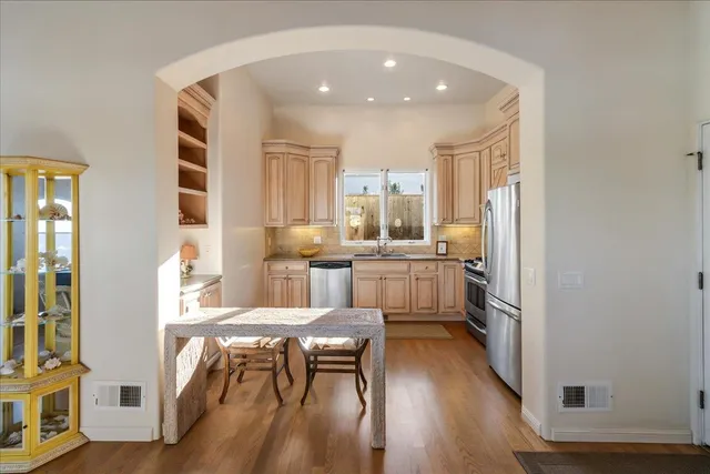 a kitchen with granite countertop a sink and a window