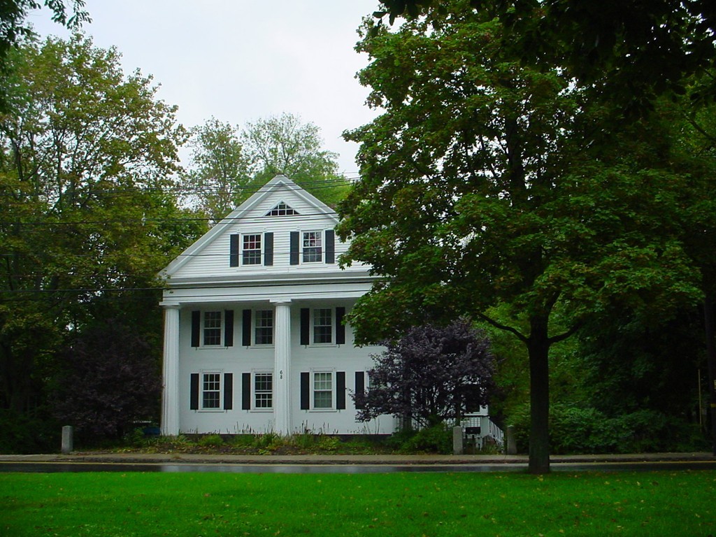 front view of a house with a yard