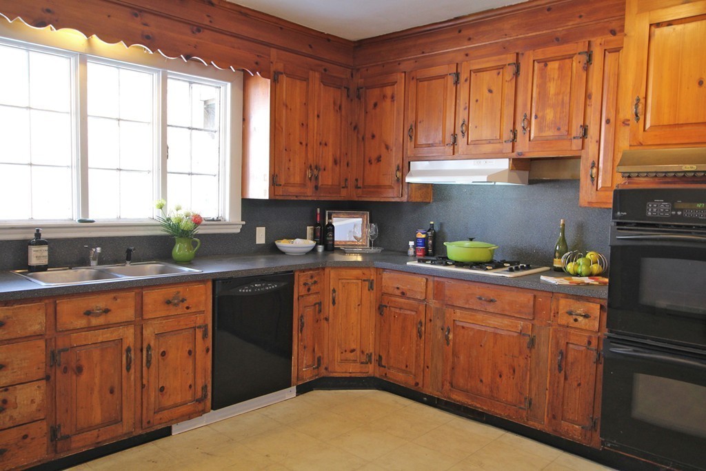 68 County Road, Unit 1 Ipswich, MA 01938 - Photo 13 of 22 a kitchen with stainless steel appliances granite countertop a refrigerator sink and cabinets