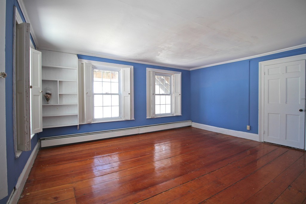 68 County Road, Unit 1 Ipswich, MA 01938 - Photo 22 of 22 wooden floor in an empty room with a window
