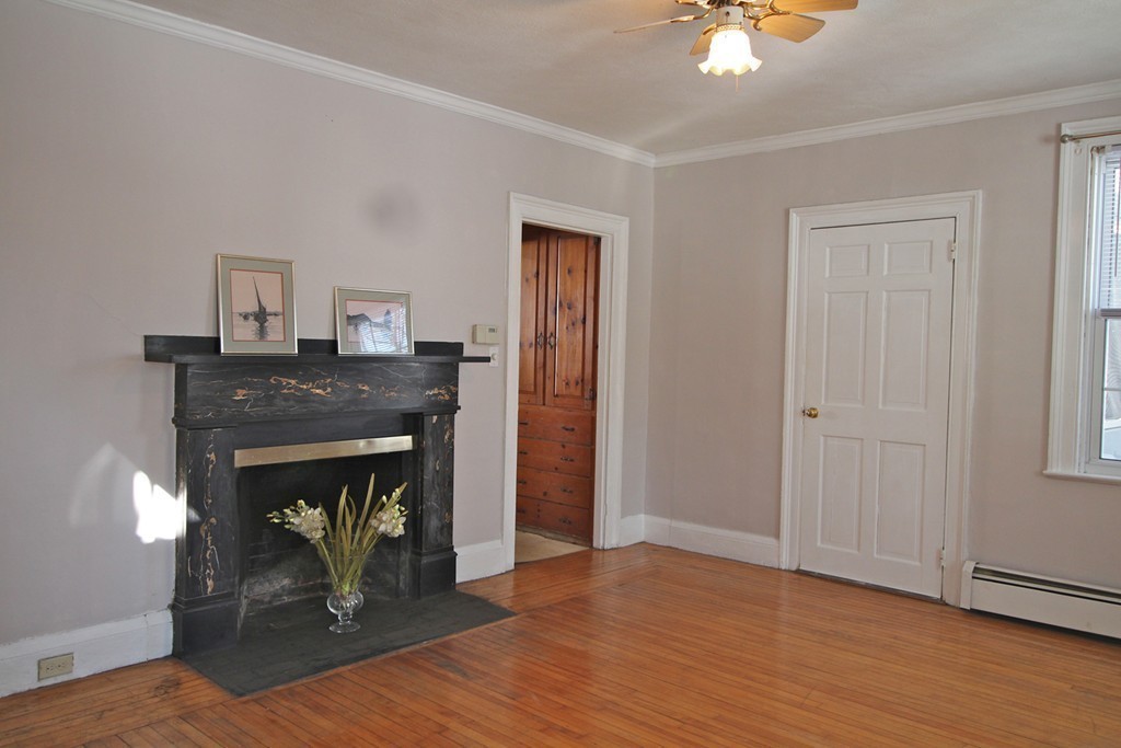 68 County Road, Unit 1 Ipswich, MA 01938 - Photo 10 of 22 a living room with a fireplace
