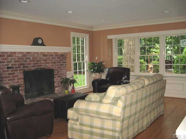 7116 Rainwater Road Raleigh, NC 27615 - Photo 2 of 12 Great family room with brick fireplace & new built-in cabinets Den/Family/Great Room